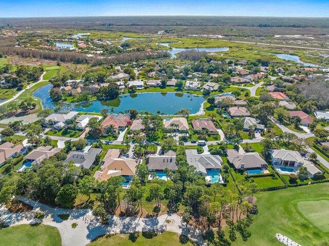 bird's eye view with a water view, golf course view, and a residential view