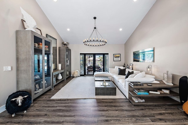 living area with high vaulted ceiling, french doors, recessed lighting, and wood finished floors