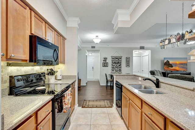 kitchen with crown molding, decorative backsplash, light tile patterned flooring, a sink, and black appliances