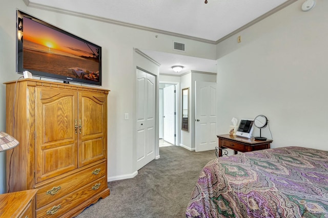 carpeted bedroom with visible vents, baseboards, and crown molding