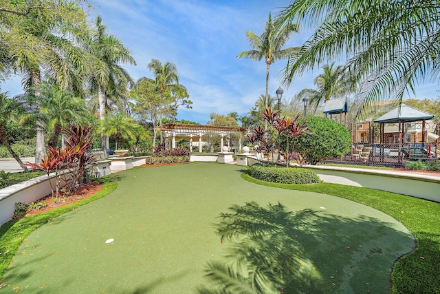 view of property's community featuring a pergola and a gazebo