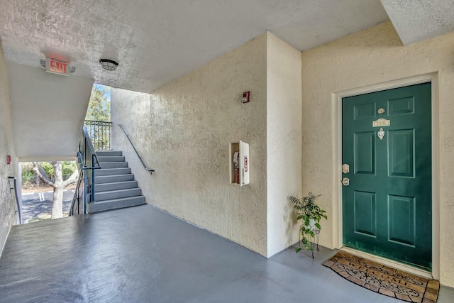 entrance to property with stucco siding