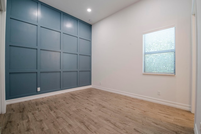 spare room featuring light hardwood / wood-style flooring