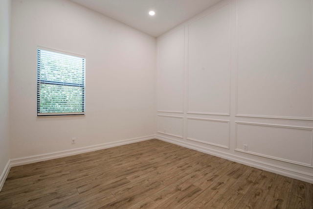 empty room featuring hardwood / wood-style flooring