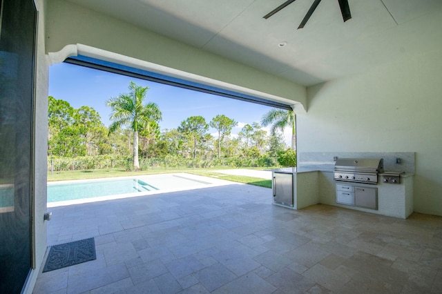 view of patio / terrace featuring area for grilling and ceiling fan