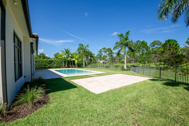 view of pool featuring a patio and a lawn