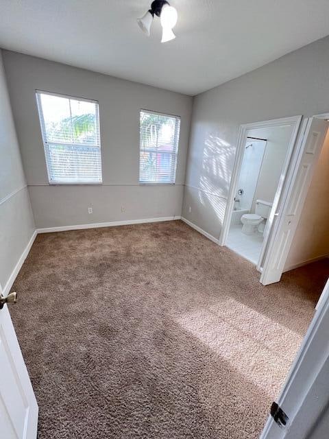 unfurnished room featuring carpet floors