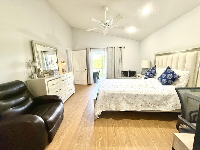 bedroom with ceiling fan, access to exterior, light hardwood / wood-style floors, and vaulted ceiling