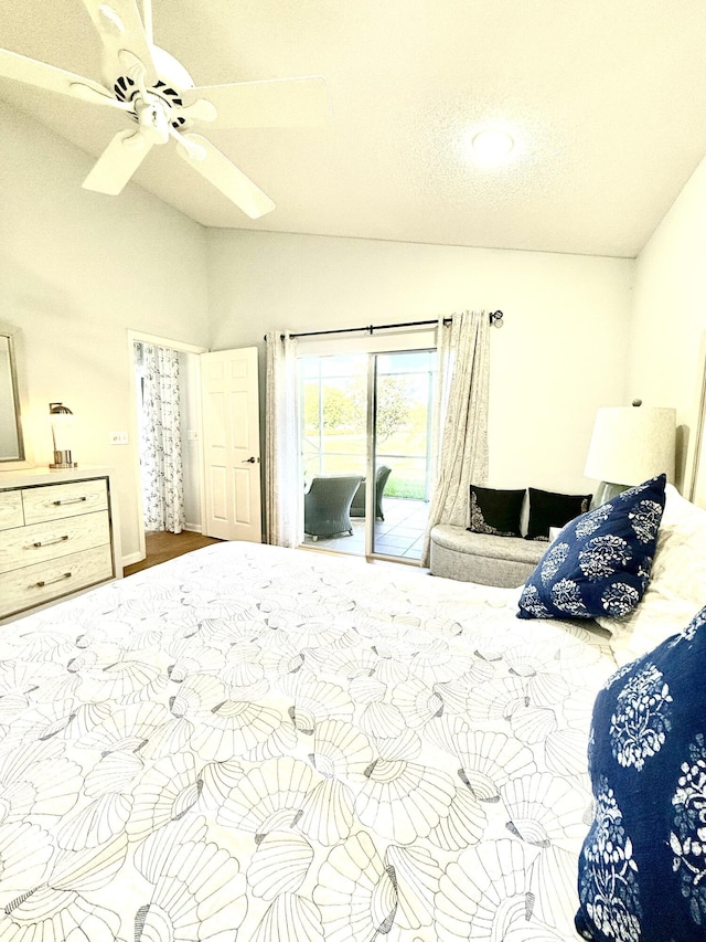 bedroom featuring ceiling fan, lofted ceiling, and access to outside