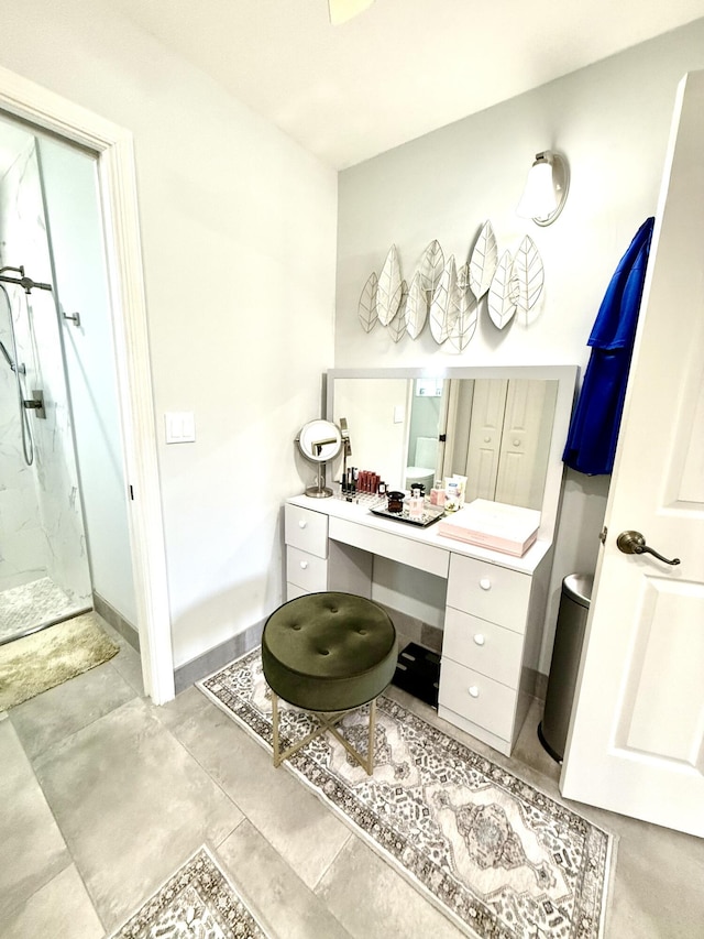 bathroom with vanity and a shower with shower door