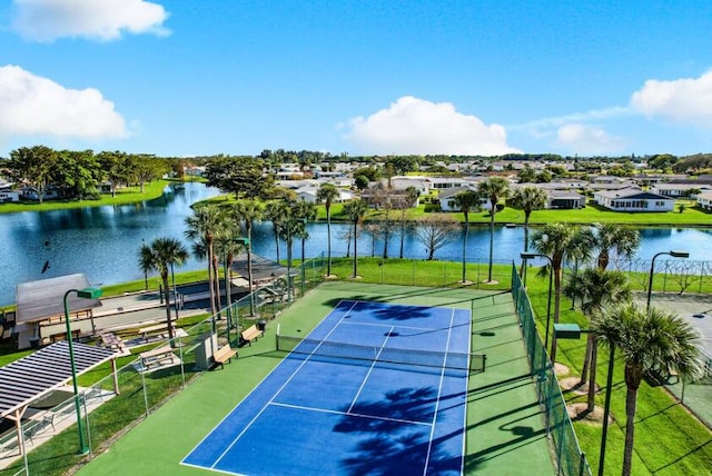 view of sport court featuring a water view