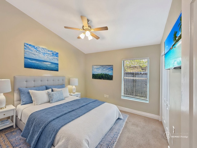 bedroom with carpet, lofted ceiling, and ceiling fan