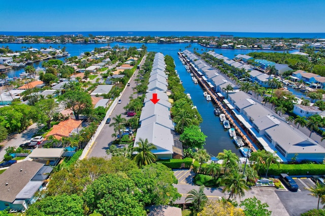 bird's eye view featuring a water view and a residential view