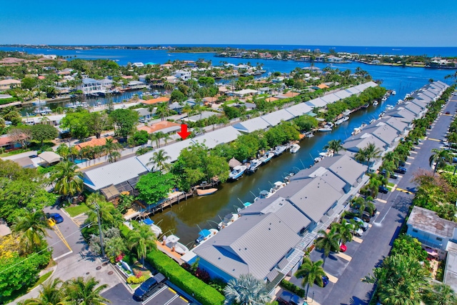 birds eye view of property with a water view and a residential view