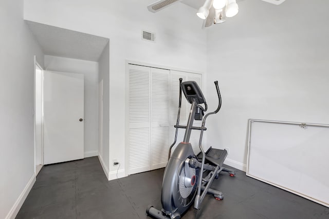 workout room with a ceiling fan, baseboards, and visible vents