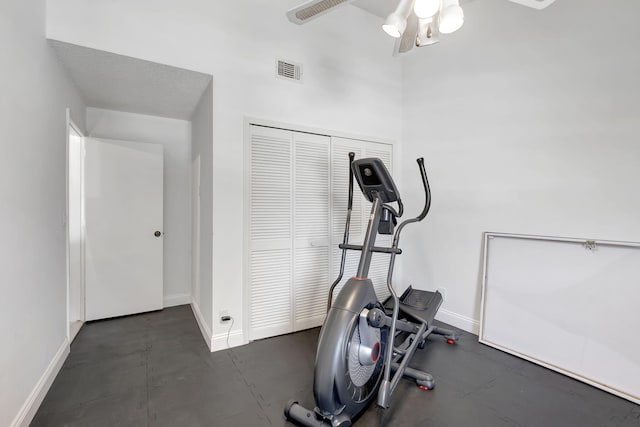 workout area featuring a textured ceiling