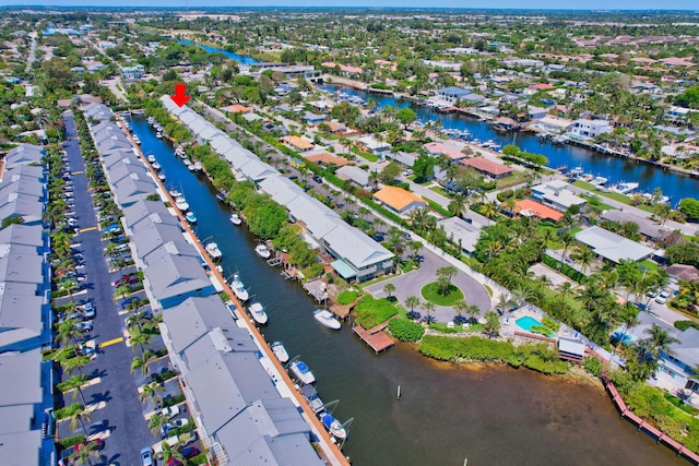 bird's eye view featuring a water view and a residential view