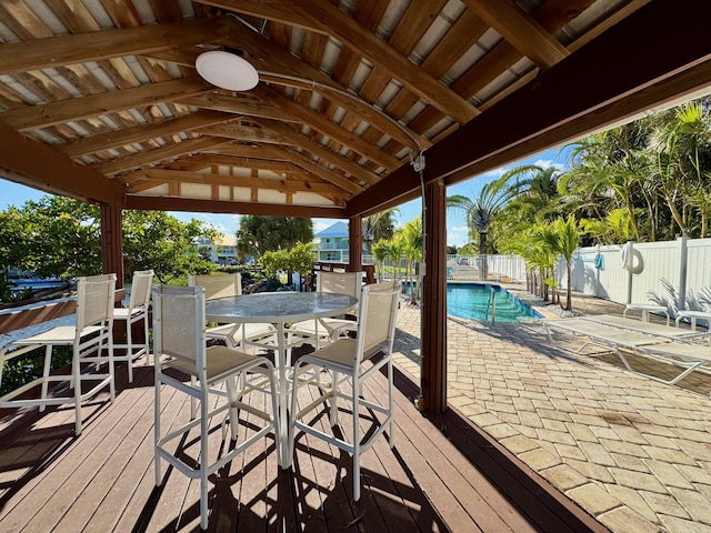 exterior space featuring fence, a gazebo, and a fenced in pool