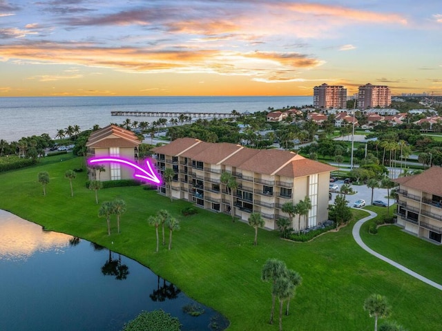 aerial view at dusk with a water view