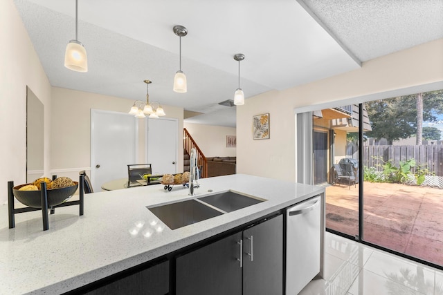 kitchen featuring hanging light fixtures, light stone countertops, stainless steel dishwasher, a notable chandelier, and sink