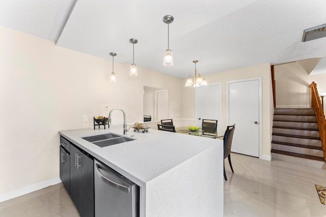 kitchen featuring kitchen peninsula, an inviting chandelier, dishwasher, decorative light fixtures, and sink