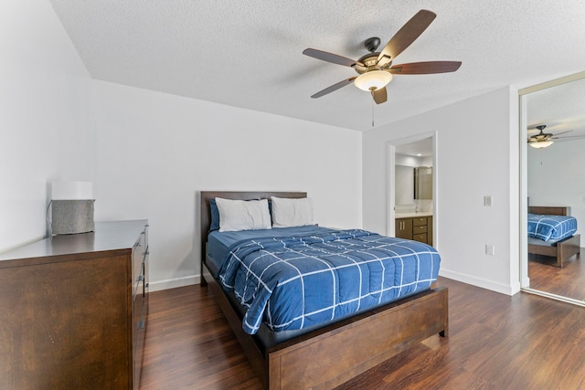 bedroom featuring connected bathroom, ceiling fan, a textured ceiling, and dark hardwood / wood-style floors