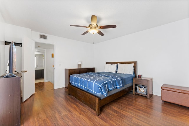 bedroom with ceiling fan and dark hardwood / wood-style flooring