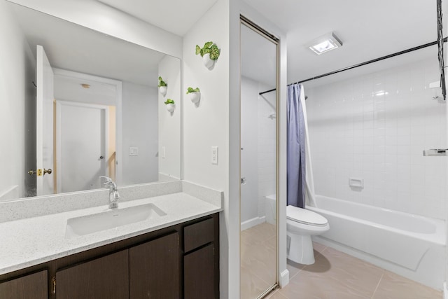 full bathroom featuring vanity, shower / bath combo with shower curtain, toilet, and tile patterned floors