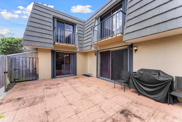 exterior space with a balcony and a patio area