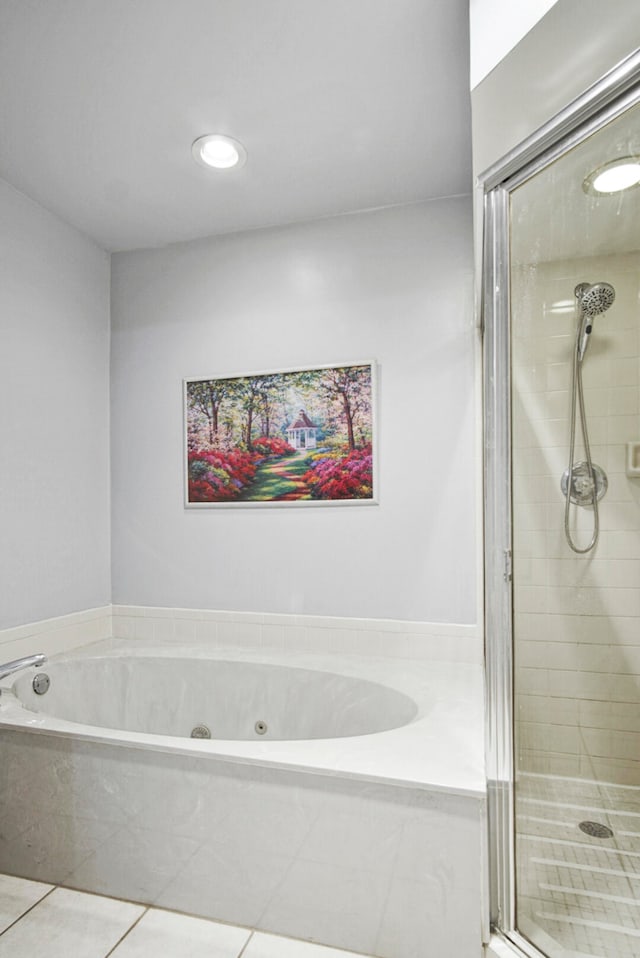 bathroom featuring independent shower and bath and tile patterned flooring