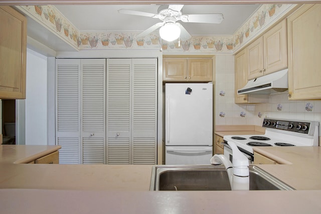 kitchen featuring tasteful backsplash, ceiling fan, light brown cabinetry, sink, and white appliances