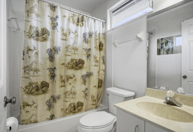 full bath with vanity, toilet, and shower / bath combo