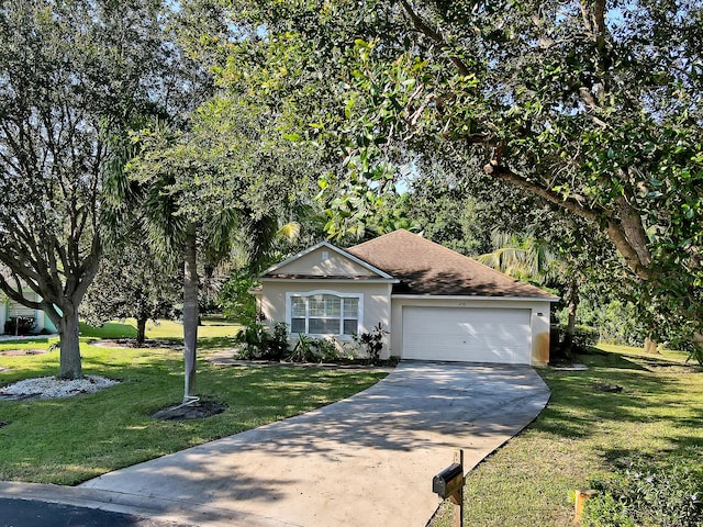 view of front of house featuring a front lawn and a garage