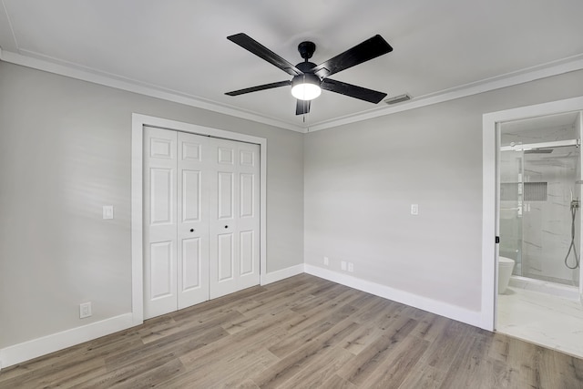 unfurnished bedroom with light hardwood / wood-style floors, crown molding, connected bathroom, and ceiling fan