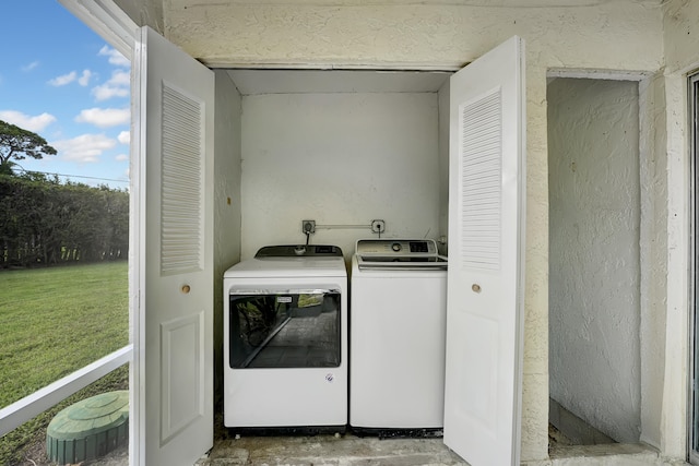 clothes washing area with independent washer and dryer