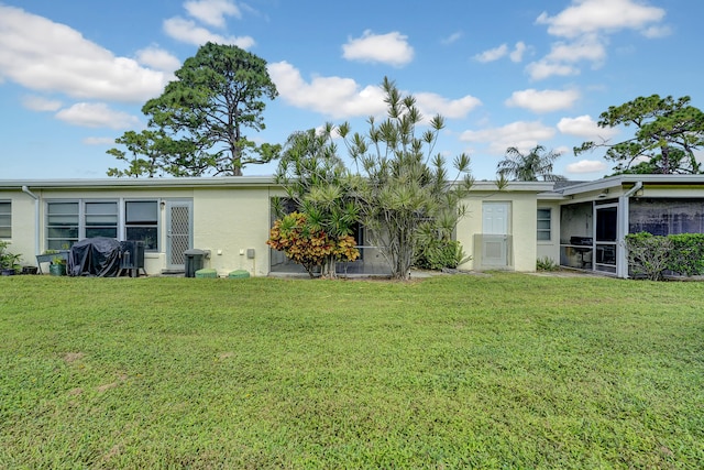 view of yard with a sunroom