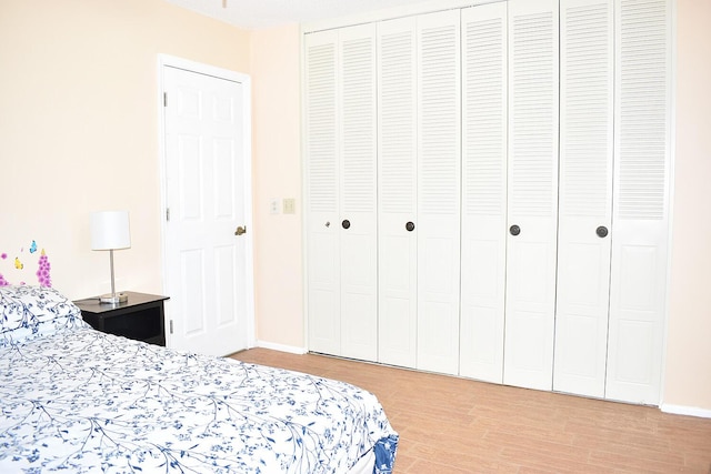 bedroom with hardwood / wood-style flooring