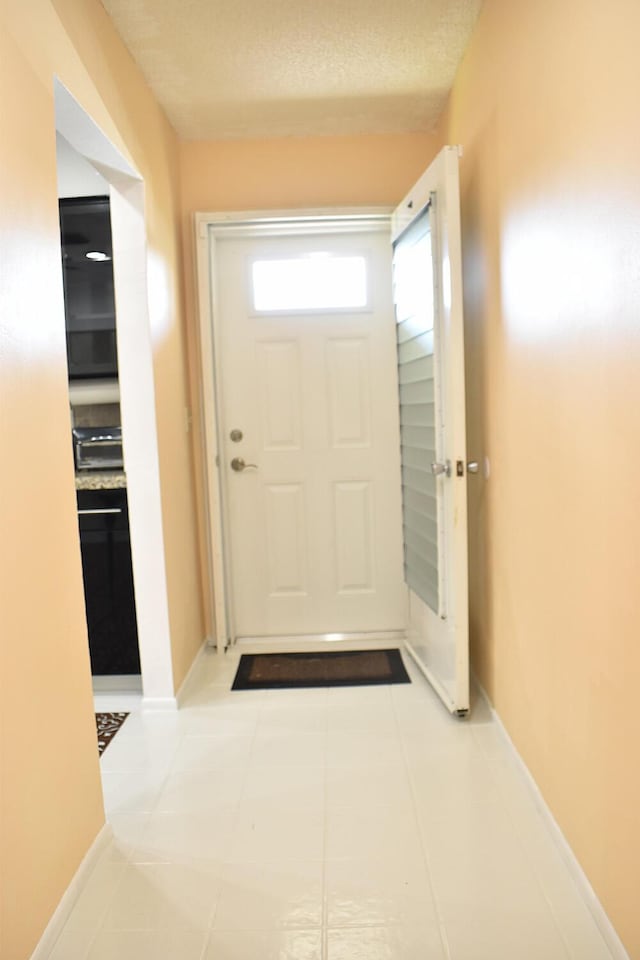 entryway featuring light tile patterned floors