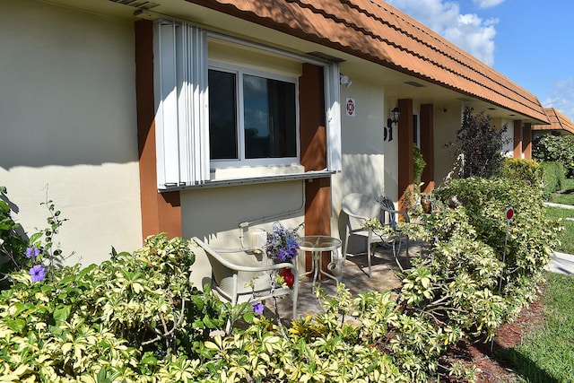 view of side of home featuring a patio