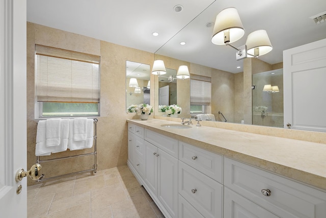 bathroom with vanity, tile patterned floors, and an enclosed shower