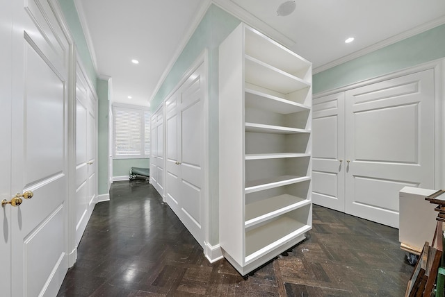 spacious closet with dark parquet floors