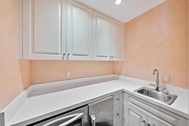 425 Worth Ave Unit 2F, Palm Beach, FL 33480 - kitchen with a sink, white cabinets, and light countertops