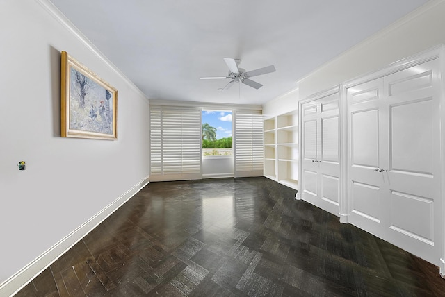 unfurnished bedroom with dark parquet flooring, ceiling fan, and ornamental molding