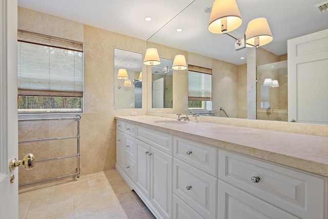 425 Worth Ave Unit 2F, Palm Beach, FL 33480 - bathroom featuring healthy amount of natural light, vanity, walk in shower, and recessed lighting