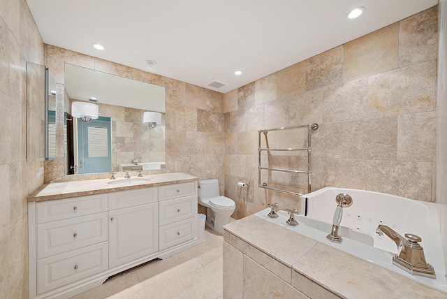 425 Worth Ave Unit 2F, Palm Beach, FL 33480 - bathroom with tile walls, toilet, a whirlpool tub, vanity, and tile patterned floors