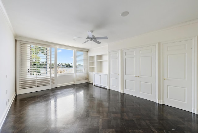 425 Worth Ave Unit 2F, Palm Beach, FL 33480 - unfurnished bedroom with baseboards, ornamental molding, and ceiling fan