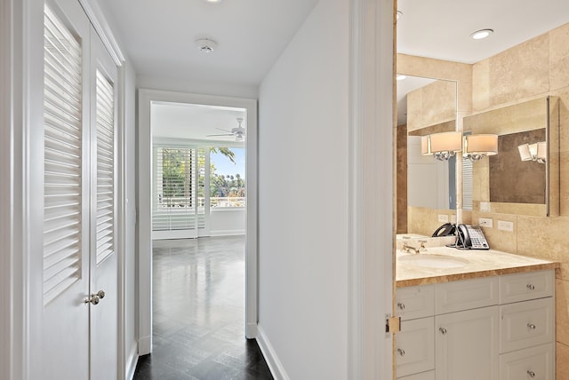 425 Worth Ave Unit 2F, Palm Beach, FL 33480 - bathroom featuring vanity, baseboards, and ceiling fan