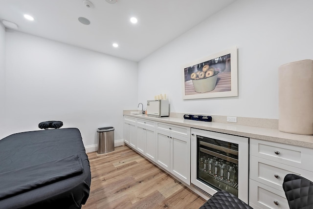 425 Worth Ave Unit 2F, Palm Beach, FL 33480 - bar with wine cooler, light wood finished floors, recessed lighting, and a sink