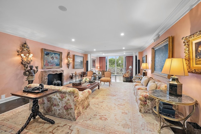 living room with hardwood / wood-style flooring and ornamental molding