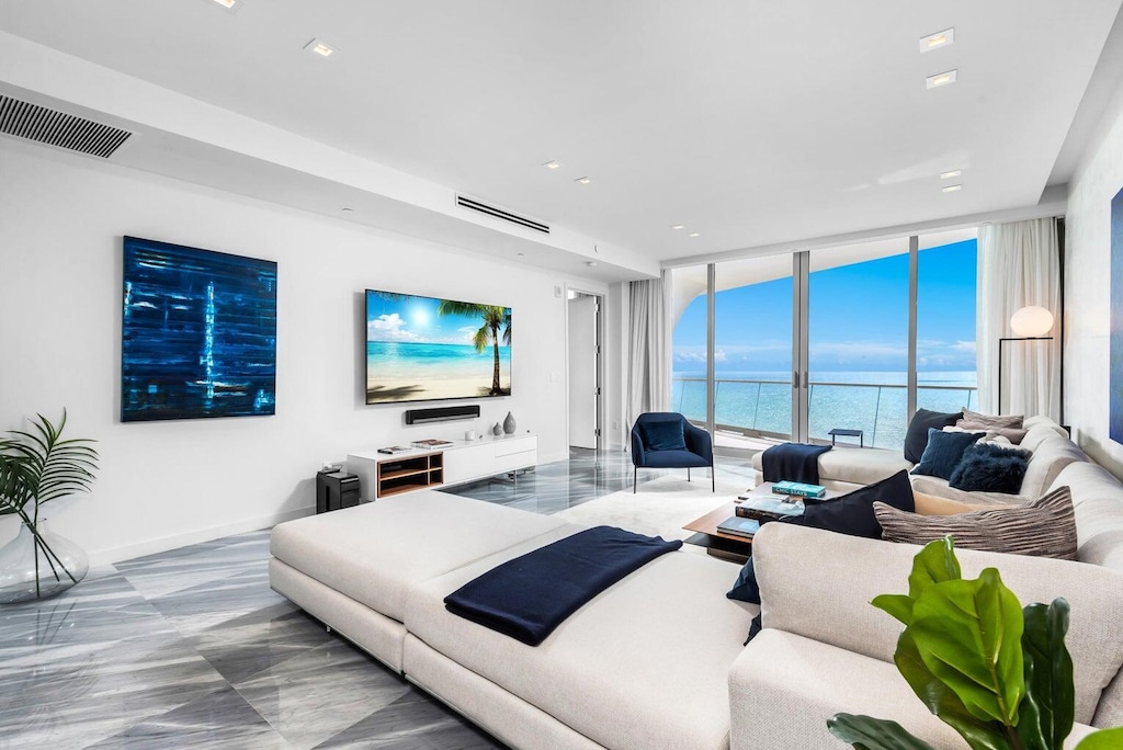 living room featuring a wall of windows